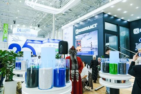 Exhibition booth with plastic raw material in glass jars for cable industry. Stock Photos