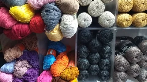 Exhibition of colored woolen threads for crochet and knitting. Video stock 304652165