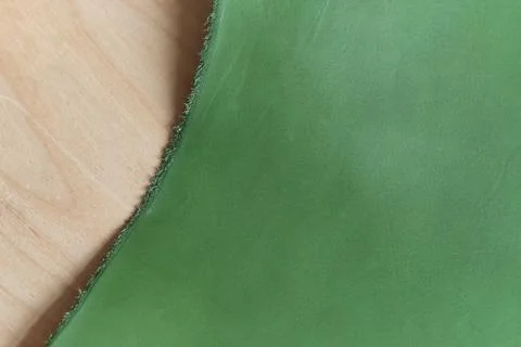 Exhibition featuring a range of high-quality green leather swatches in various Stock Photos