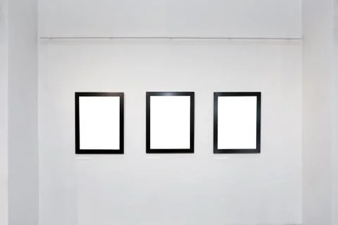 Exhibition gallery interior with empty frames on wall Stock Photos