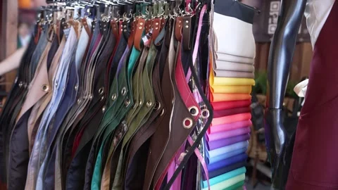 Exhibition rail featuring handmade aprons crafted from heavy-duty fabrics and Stock Footage 320520573