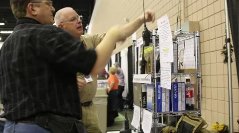 Exhibitor Talks about Products at Prepper Convention Stock Footage 64907630