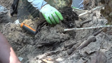 Exhumation of Human Remains Stock Footage 109535056