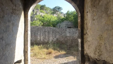 Exit from Abandoned Stone House to Courtyard Stock Footage 338203152