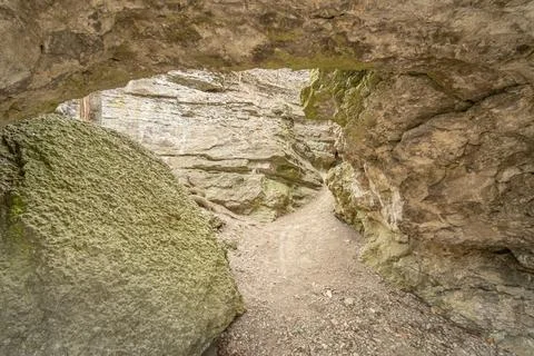 Exit from the cave in the rock. View from inside. Stock-Fotos