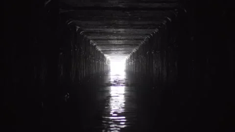 Exit from the drainage sewage rectangular tunnel. Empty concrete Drainage Stock Footage 154041247