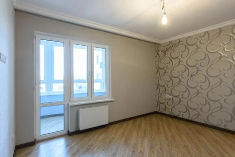 Exit to a glazed loggia in the interior of an empty room Stock Photos
