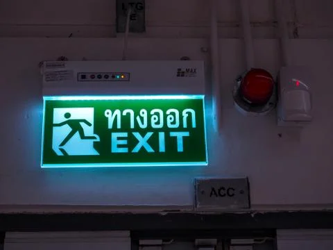 Exit light box (with Thai text) to define this is the way to run out Stock Photos