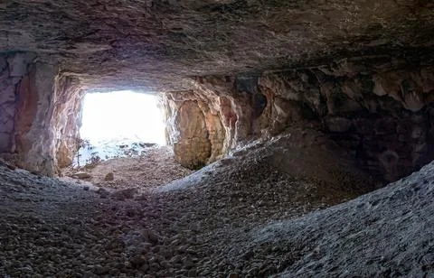 Exit from the mountain cave Stock Photos