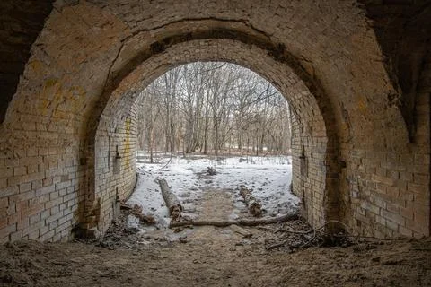 Exit from the old abandoned brick arch tunnel of the 19th century fortificati Stock-Fotos
