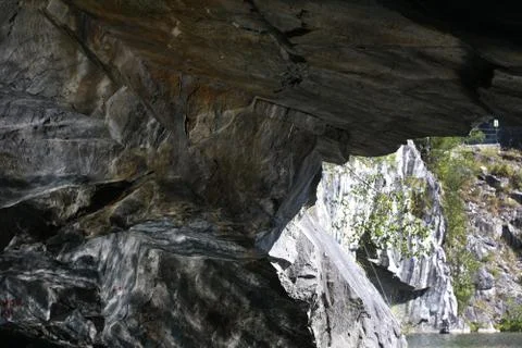 The exit of rock cave Stock Photos