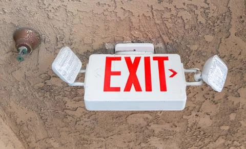 Exit sign with emergency light  and fire extinguishing system Stock Photos