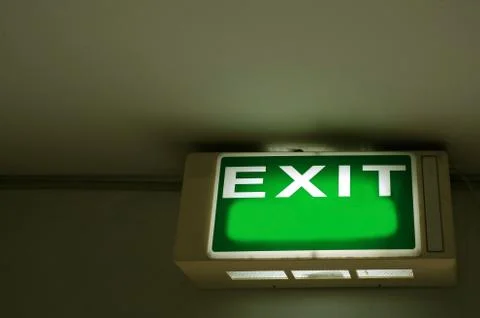 Exit sign hanging on the ceiling with copy space Stock-Fotos