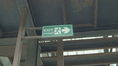 Exit sign inside industrial building in slow motion Stock-Footage 337382583
