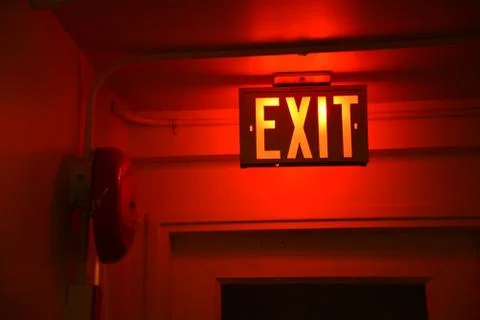 Exit Sign Red Glow with Fire Bell Stock Photos