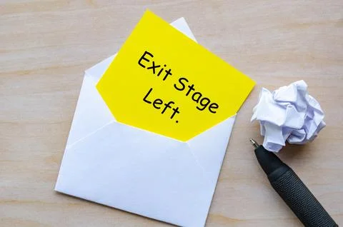 Exit Stage Left text on yellow paper in an envelope. Resignation concept Stock-Fotos