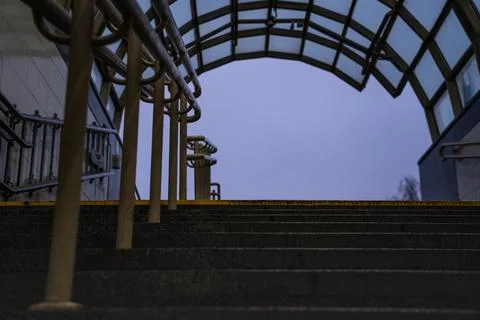 Exit from the underpass in the evening. Cloudy sky. Steps up Stock Photos
