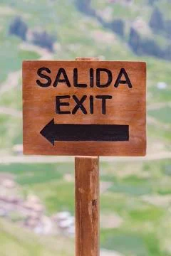 Exit Wooden rustic sign at the Inca Ruins, Peru Stock Photos