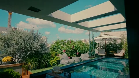 Exit to the yard of the house with vegetation and a swimming pool Stock Footage 240738041