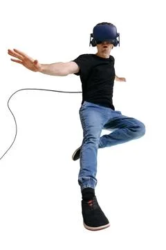 Exited guy using a virtual reality headset isolated on white background. Stock Photos