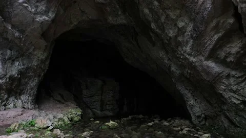 Exiting a cave in Romania Stock Footage 167859450