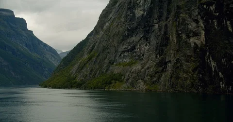 Exiting Geiranger fjords with cruise ship Stock Footage