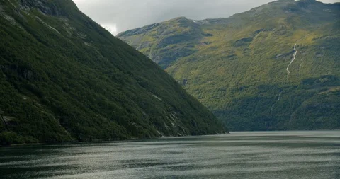Exiting Geiranger fjords with cruise ship Stock Footage