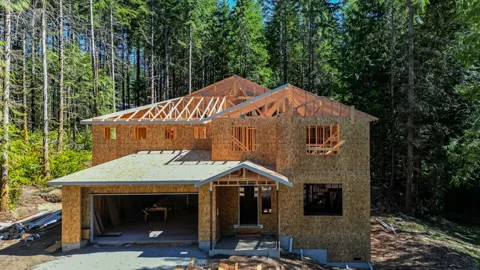 Exiting a mid construction home to reveal the exterior Stock Footage 204738008