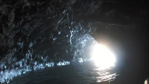 Exiting Sea Cave Stock Footage 138475706