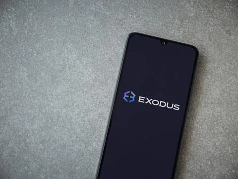 Exodus app launch screen on smartphone on ceramic stone background Stock Photos
