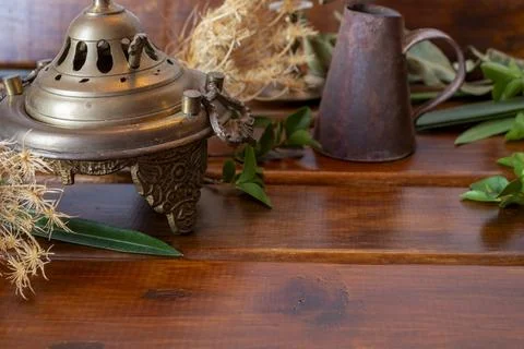 Exoteric rituals, background with containers and green leaves Stock Photos