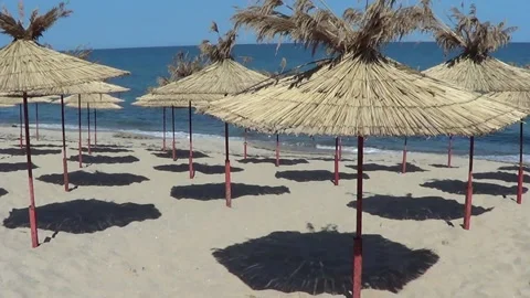 Exotic beach umbrellas Stock Footage 159742506