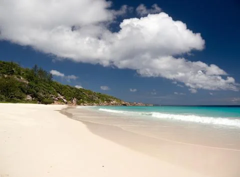 The exotic beach under the blue sky cloud Stock Photos