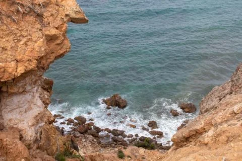 Exotic cliff rock, background sea Stock Photos