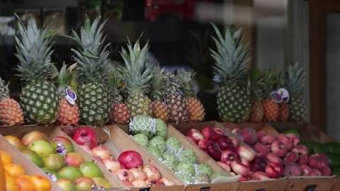Exotic fruit store in England - pineapples Stock Footage 80358360