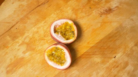 Exotic fruits on the table. 4k, top view, slow motion. passion fruit, rotates on Video stock 86524908