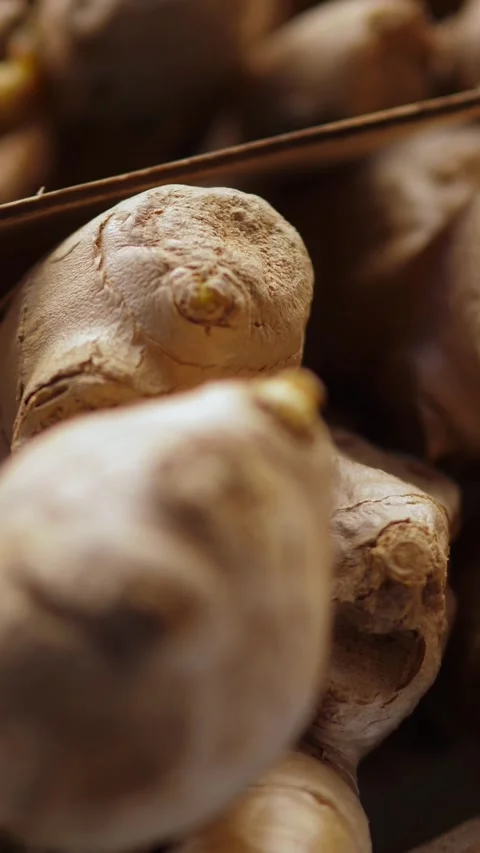 Exotic Ginger Root Piled at a Lively Italian Fruit and Vegetable Market Stock Footage 335695175