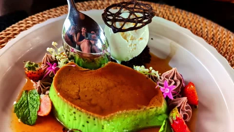 Exotic looking creme brulee with ice cream vanilla and strawberry fruit Stock Footage 312243653