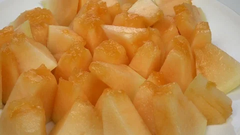 Exotic melon fruit close-up. Sliced melon on a white background Stock Footage 121200698