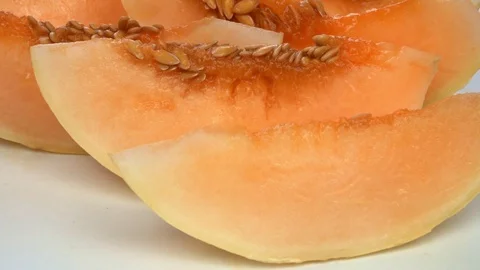 Exotic melon fruit close-up. Sliced melon on a white background Stock Footage 121200754