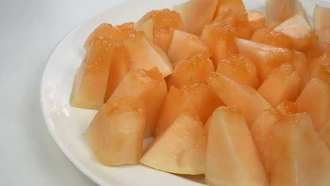 Exotic melon fruit close-up. Sliced melon on a white background Stock Footage 121200867