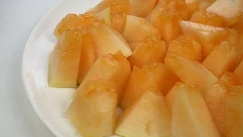 Exotic melon fruit close-up. Sliced melon on a white background Stock-Footage 121299675