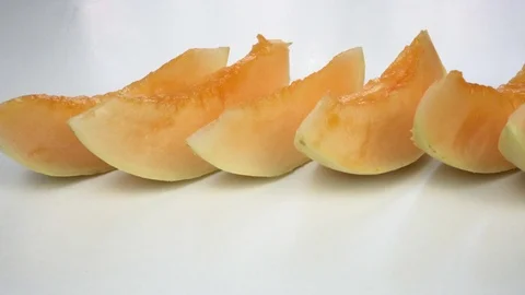 Exotic melon fruit close-up. Sliced melon on a white background Stock-Footage 121399909