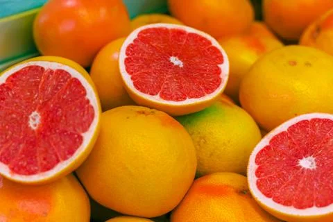 .Exotic  red grapefruit. Cut in a half. Stock Photos
