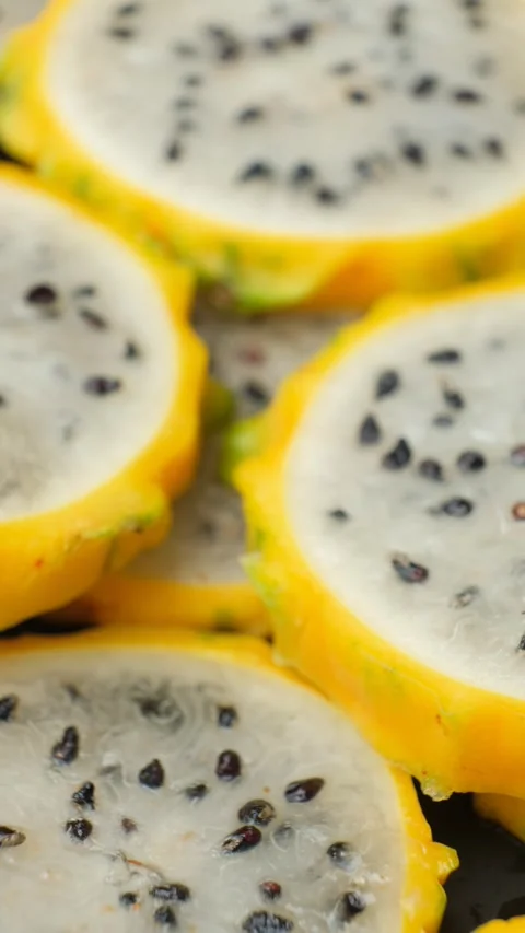 Exotic tropical fruit background with round dragon fruit pitaya slices. Stock Footage 339614408
