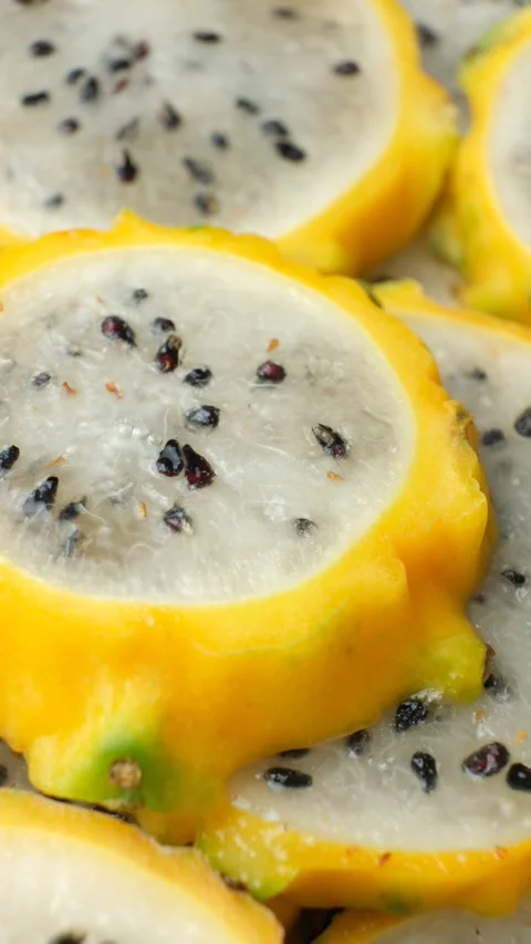 Exotic tropical fruit background with round dragon fruit pitaya slices Stock Footage 340167932