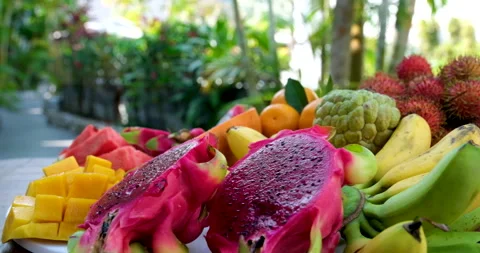 Exotic tropical fruit on table. Dolly shot. Stock Footage 295158993