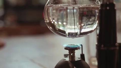 Exotic,alternative way of making coffee, burning fetil boils water Video stock 69082204