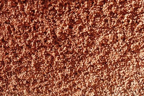 Expanded clay concrete texture. Red pink relief plaster, full frame Stock Photos