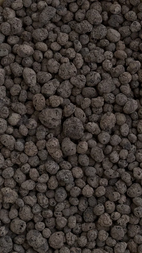 Expanded clay pellets background. Vertical video. Video stock 277419351